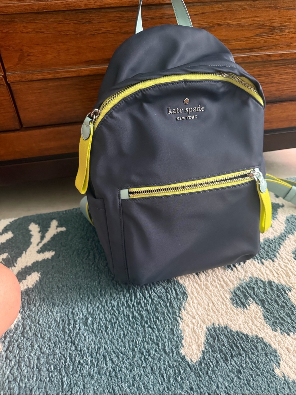 kate spade navy backpack with yellow accents